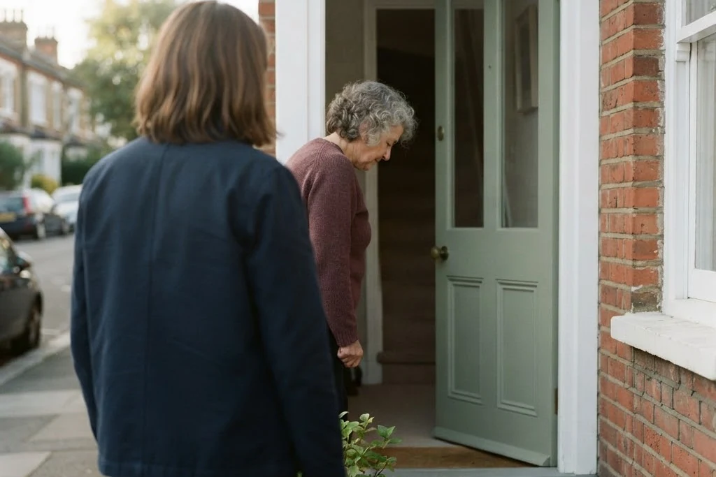 Two people meeting at the open front door of a house, for tenant services in Brampton
