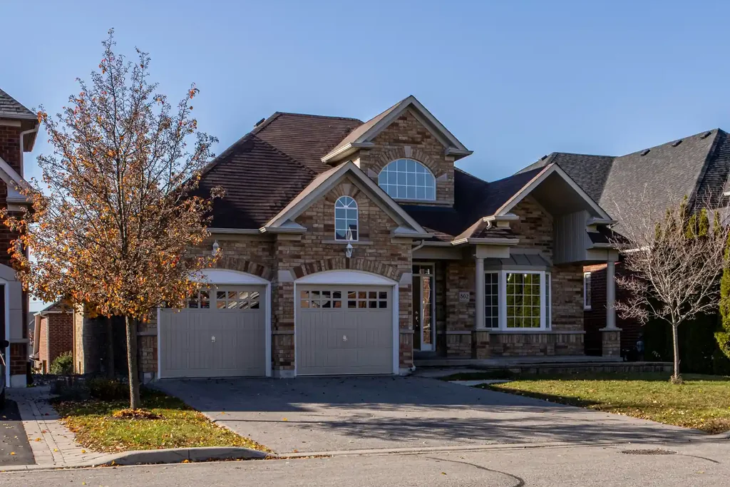A brick family home with an autumn tree in the front garden, for tenant placement in Brampton